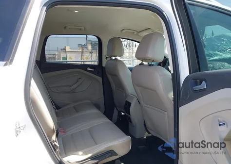 2017 Ford Escape Titanium z USA, uszkodzony, nr VIN 1FMCU0J91HUD85387